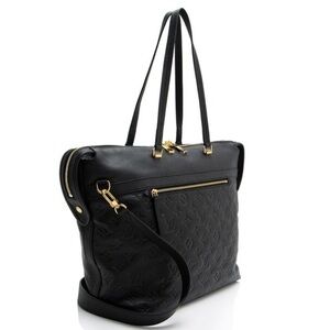 Louis Vuitton Bow tie bag. Black leather exterior. Grey and black interior.